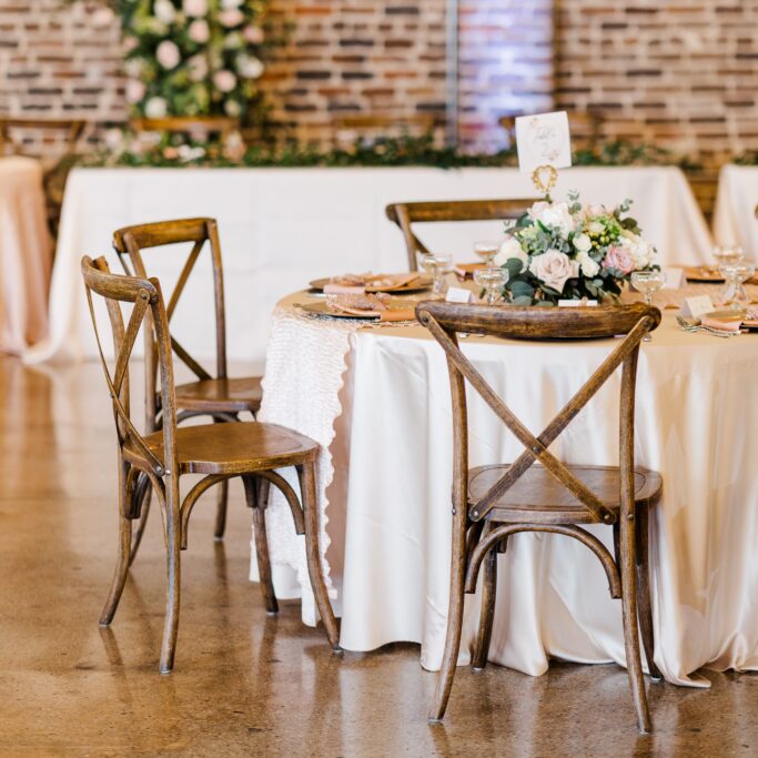 table and chairs at wedding