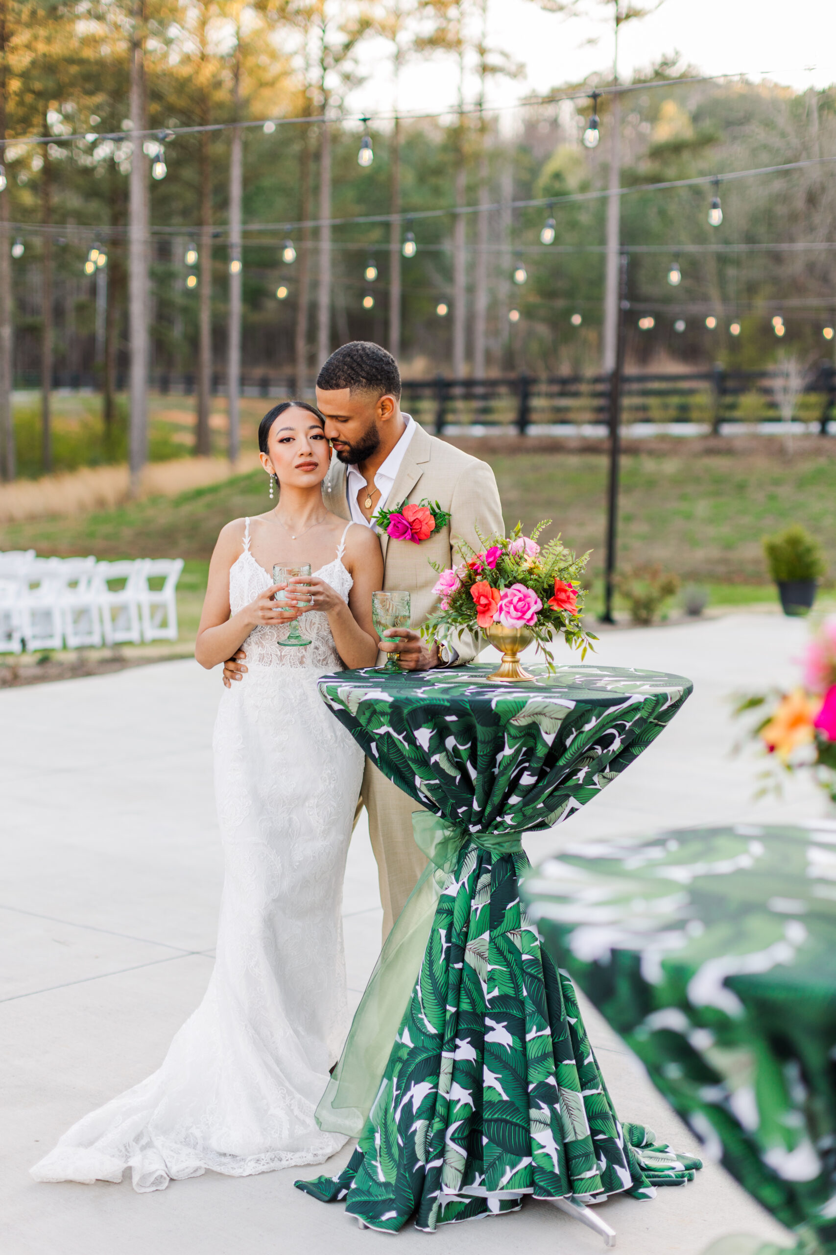 bride and groom standing beside a table